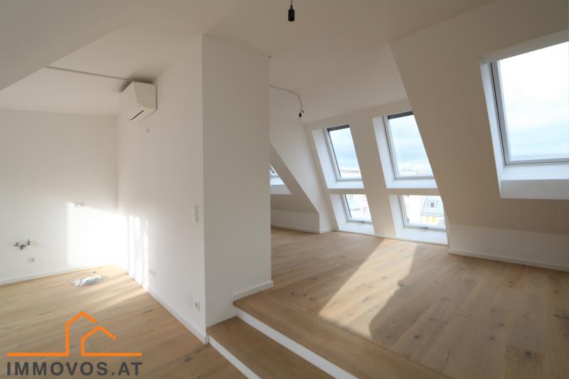 Zentral im 9. mit 22 m2 S&#252;dterrasse + optimales Layout in 3 Zimmer-DG-Wohnung als Erstbezug mit Klimaanlage